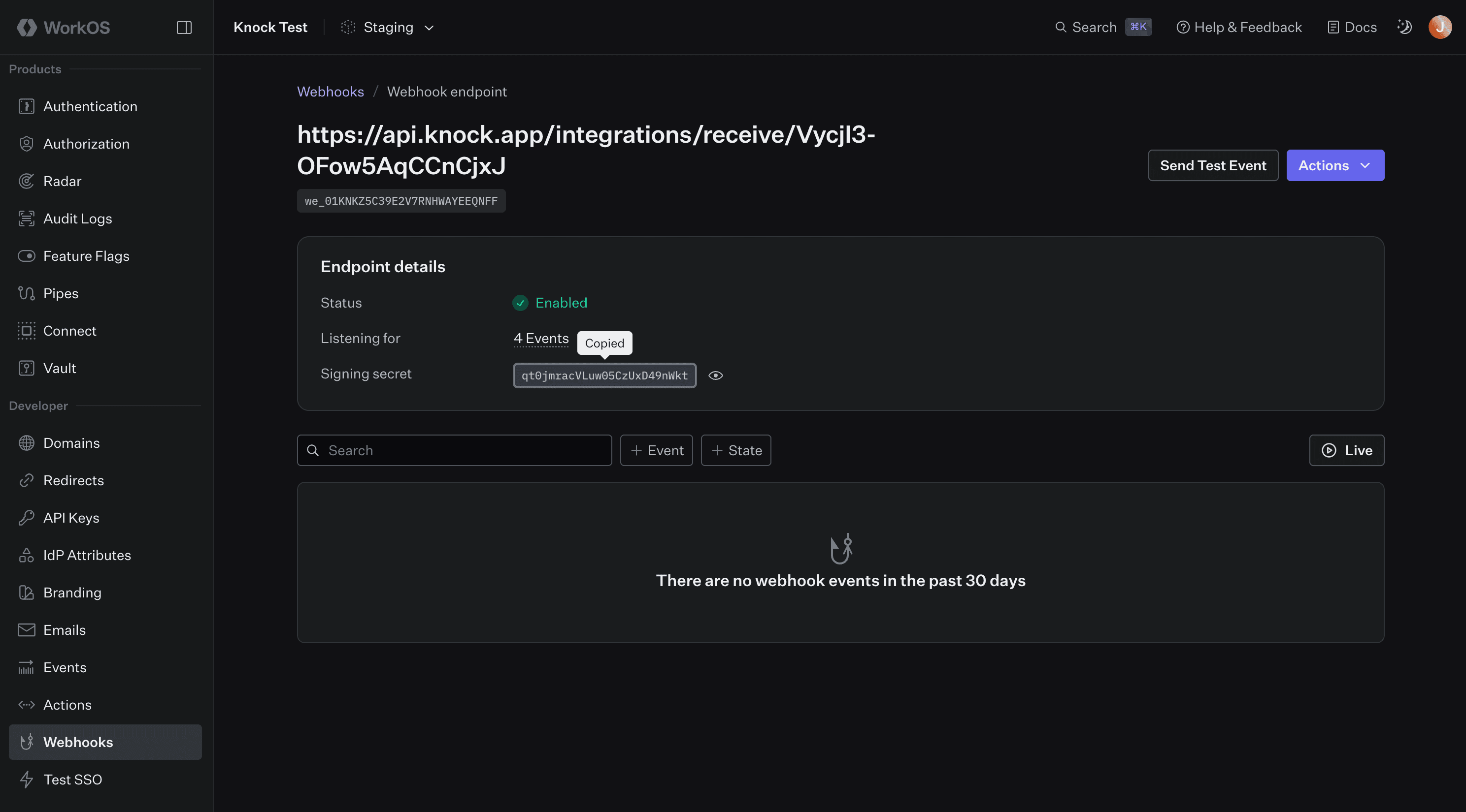 The WorkOS source setup wizard showing the webhook URL to copy